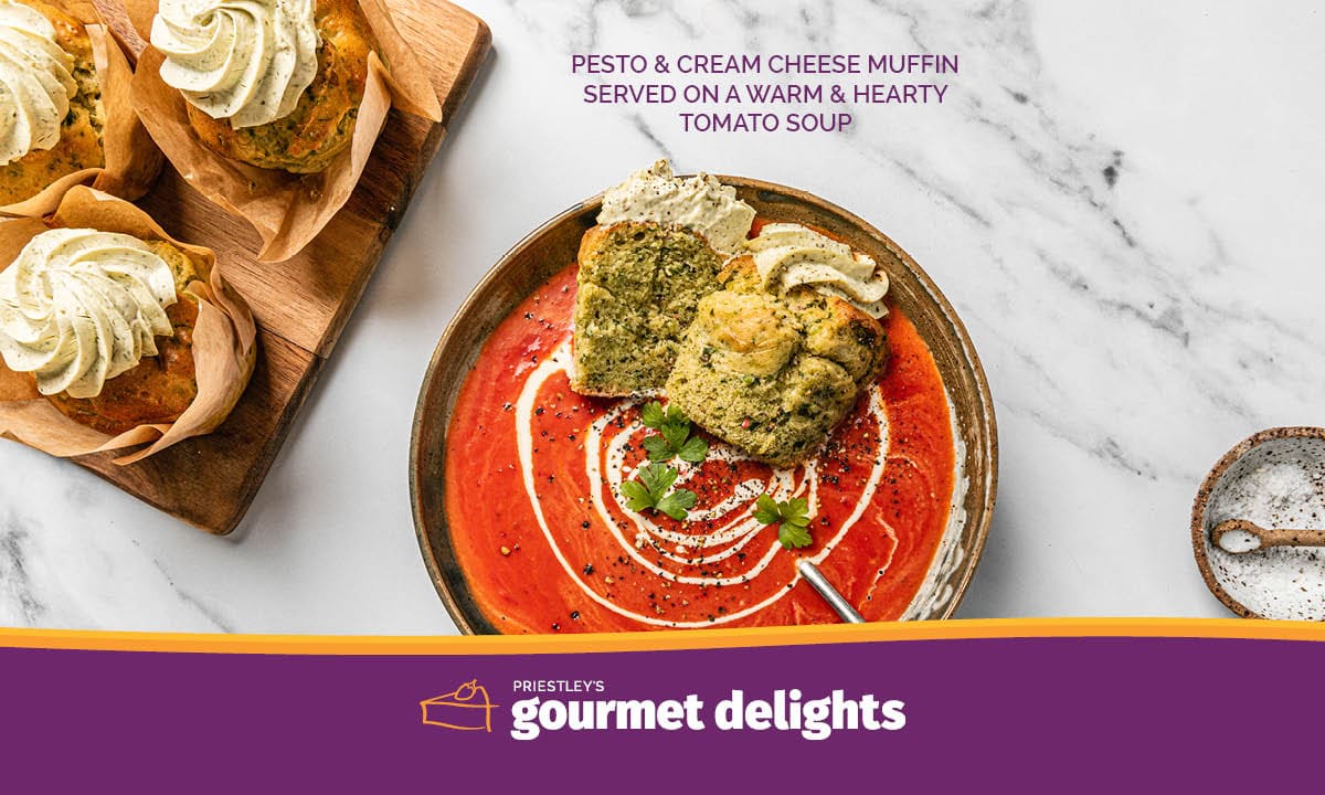 Pesto & Cream Cheese Muffin served on a warm & hearty tomato soup